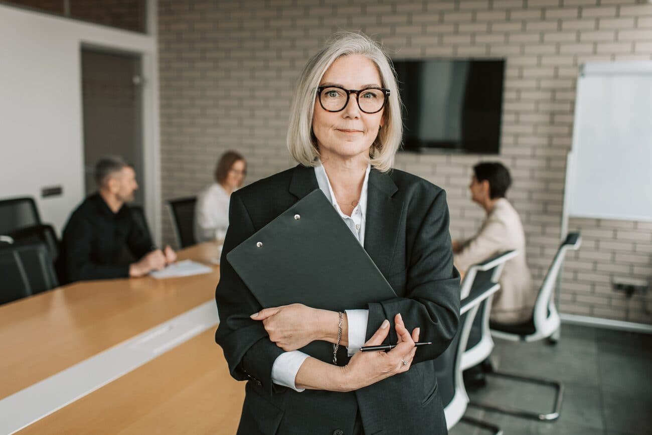 A senior leader in a meeting room